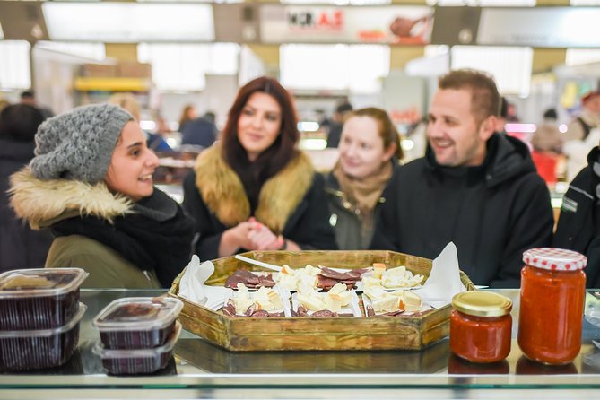 Delicious Sarajevo: Eat, Walk & Discover City Tour - Sampling cooked dishes in a traditional restaurant