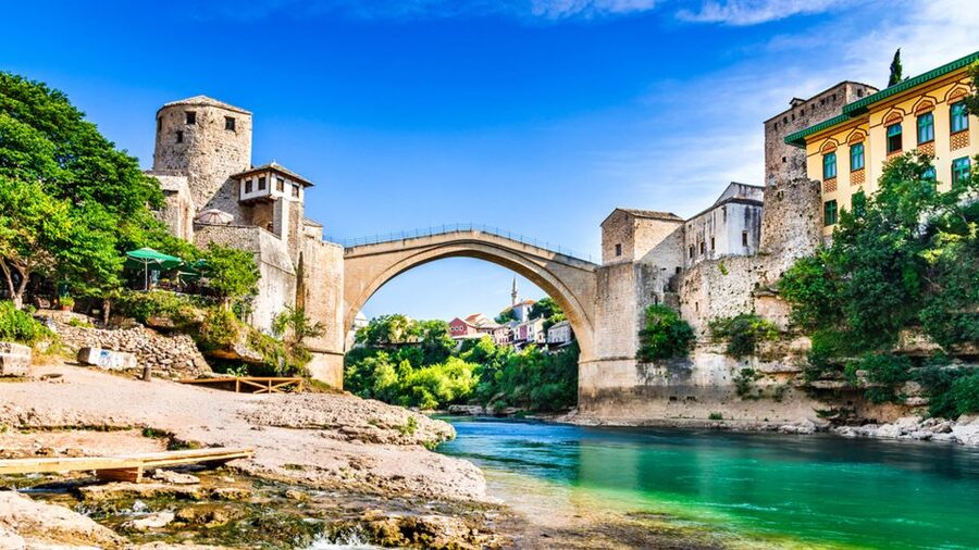 From Split and Trogir: Mostar Tour with Kravica Waterfalls - Entering Mostar through Stari Most