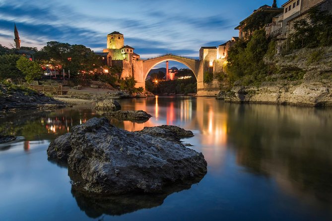 The Old Bridge at Mostar lit over the Neretva at dusk